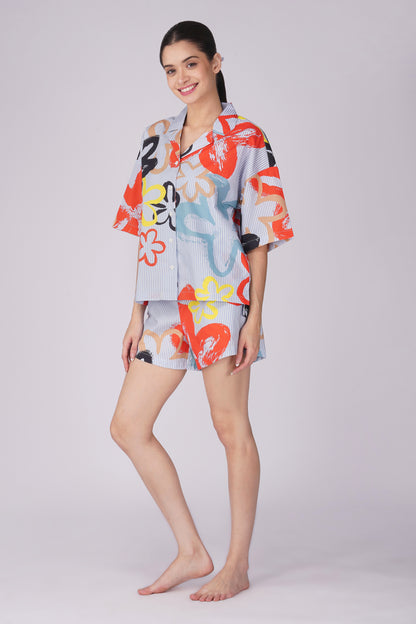 Womens cotton shorts set for lounging featuring bold pop art floral patterns and a relaxed fit, perfect for stylish comfort.